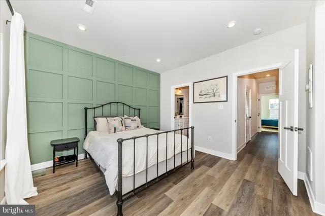 a bedroom with a bed and a view of bathroom