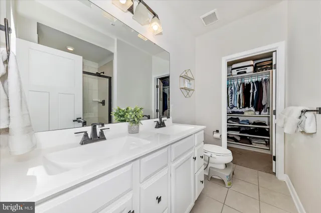 a bathroom with a sink toilet and vanity