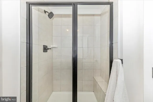 a view of a hallway with washer and dryer