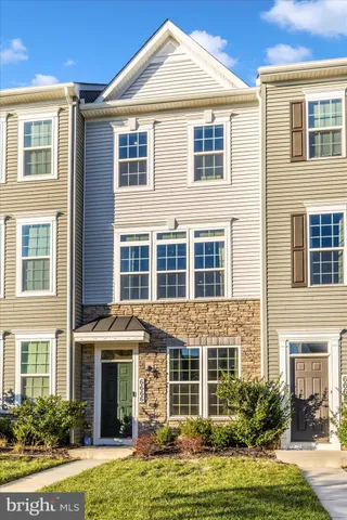a view of a patio with table and chairs and potted plants