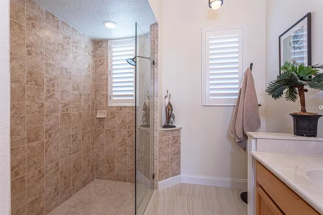 a view of a swimming pool with an outdoor seating and a garden