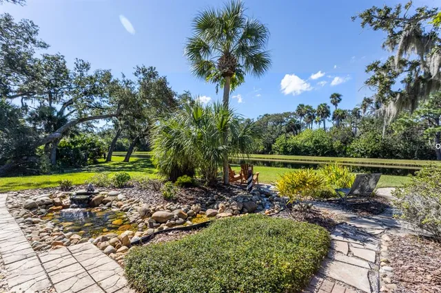 an aerial view of a house with yard swimming pool and outdoor seating