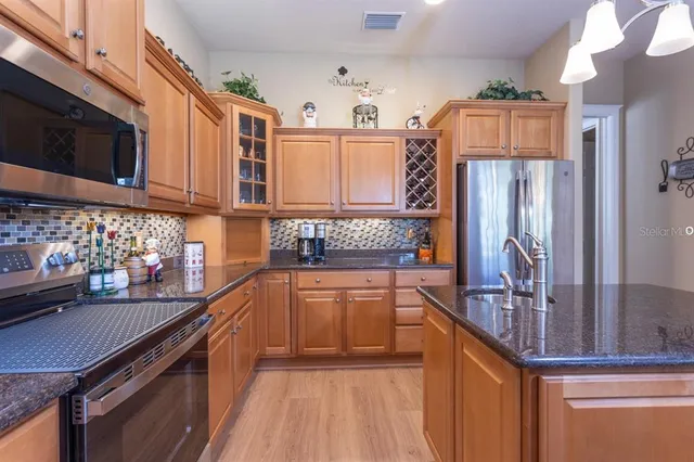 a bathroom with a sink and mirror with toilet