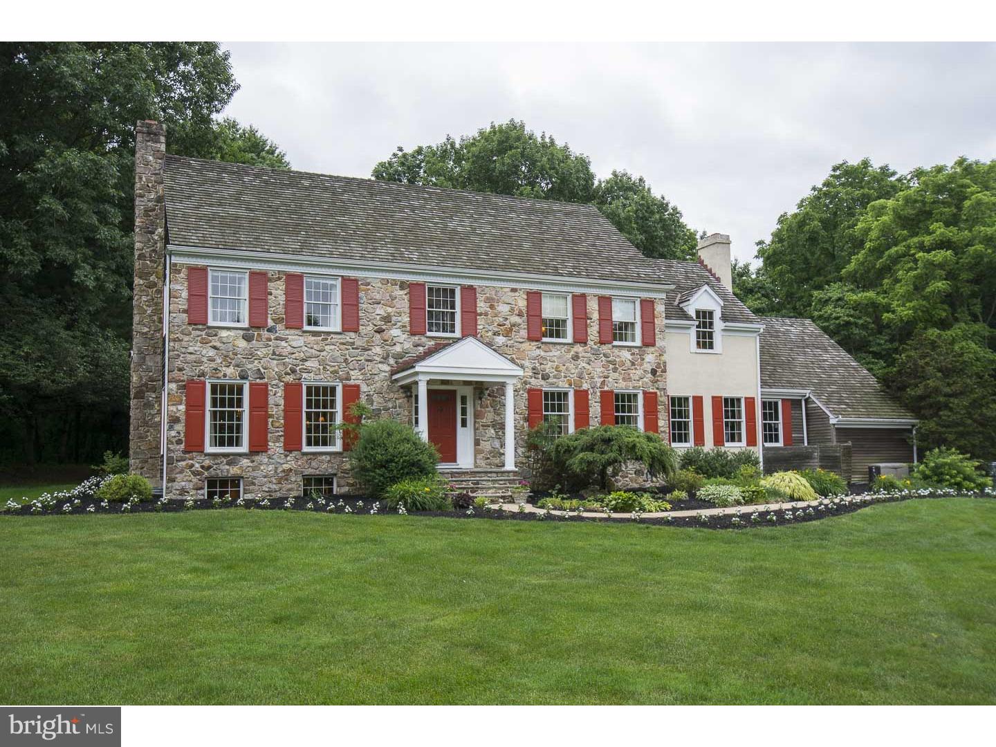 709 South Waterloo Road Devon, PA 19333 - Photo 1 of 25 a front view of a house with a yard and trees