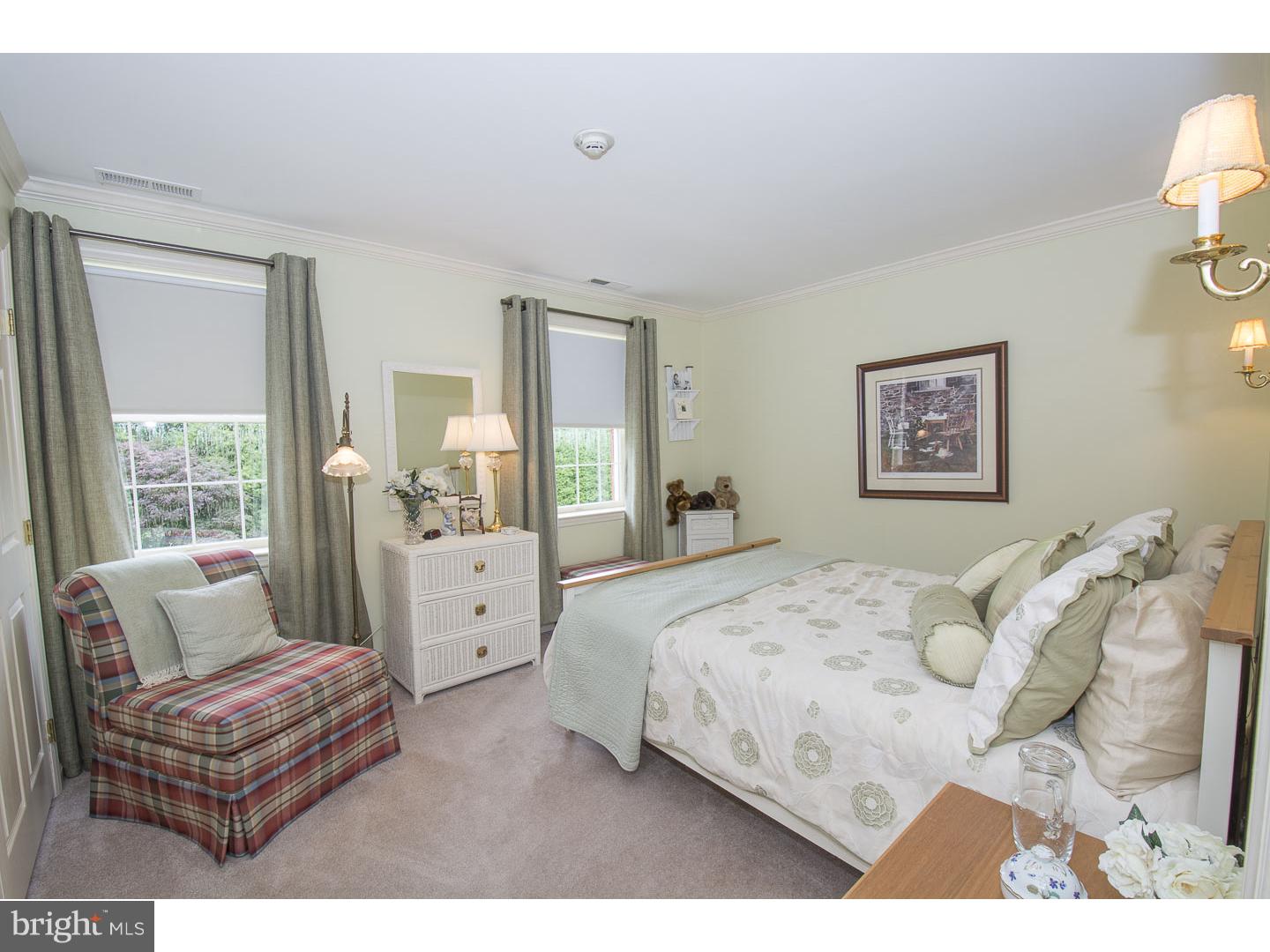 709 South Waterloo Road Devon, PA 19333 - Photo 14 of 25 a bedroom with a bed and a couch