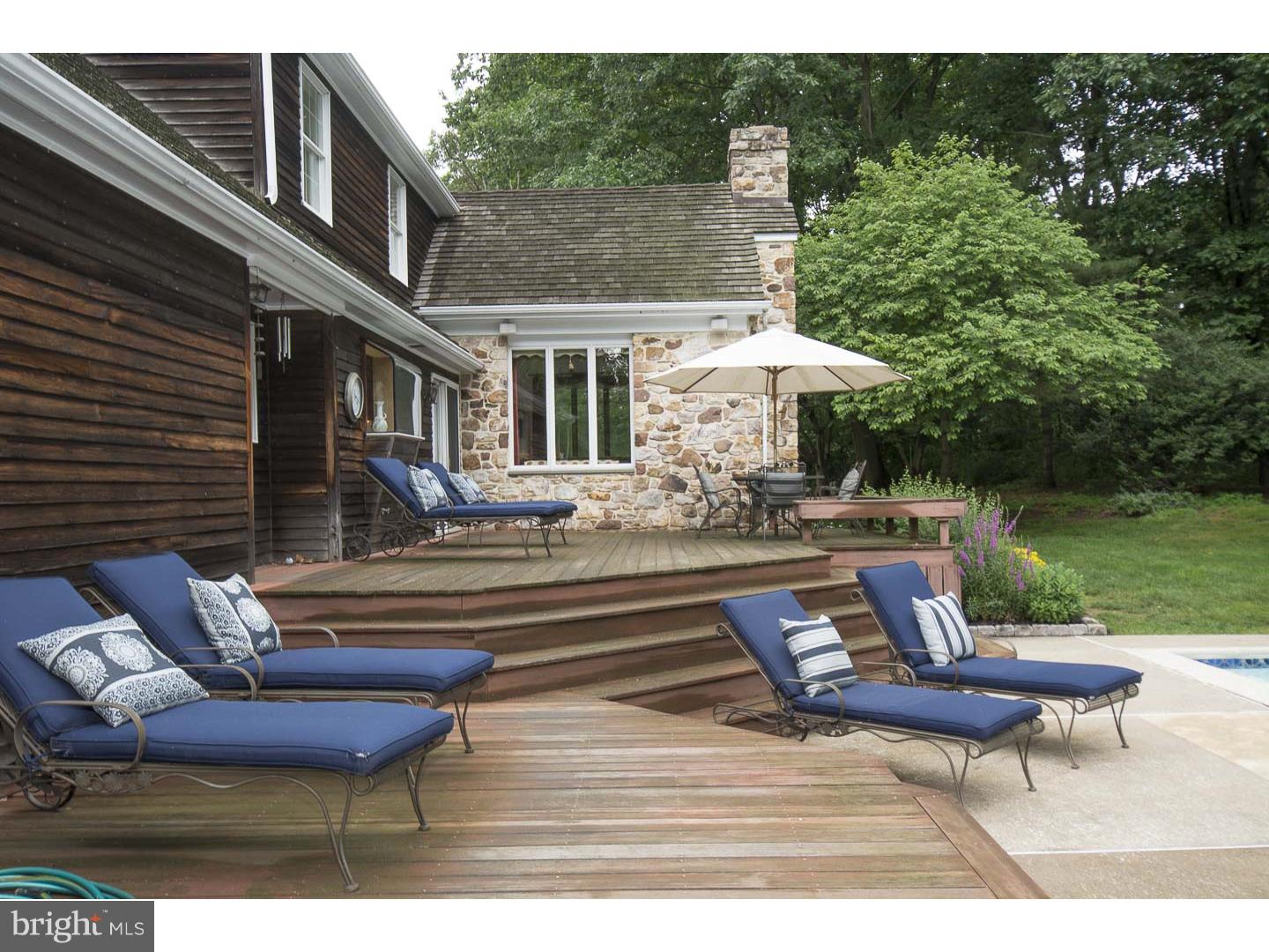 709 South Waterloo Road Devon, PA 19333 - Photo 22 of 25 a roof deck with a table and chairs