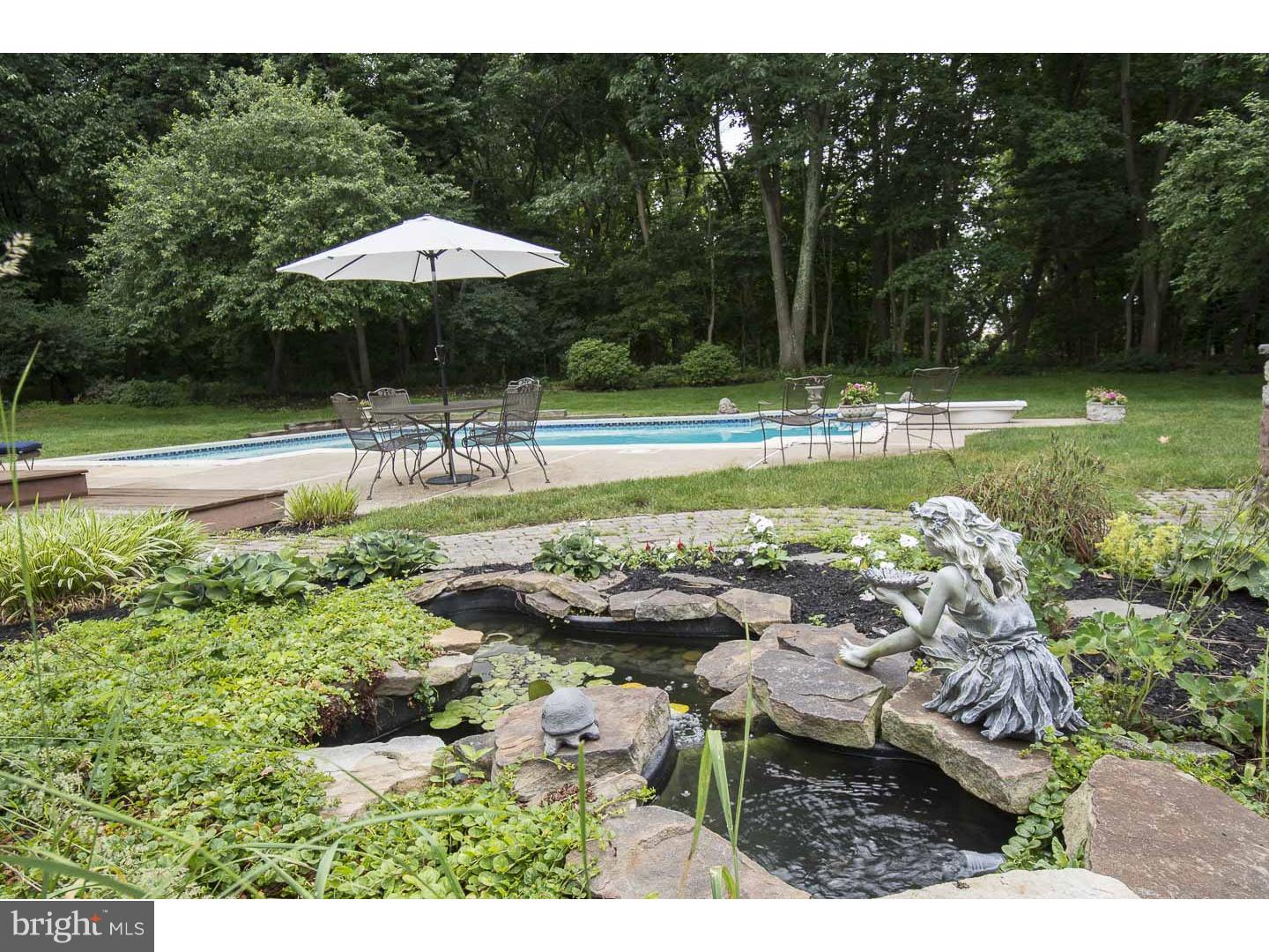 709 South Waterloo Road Devon, PA 19333 - Photo 24 of 25 a view of a swimming pool with a patio and a yard