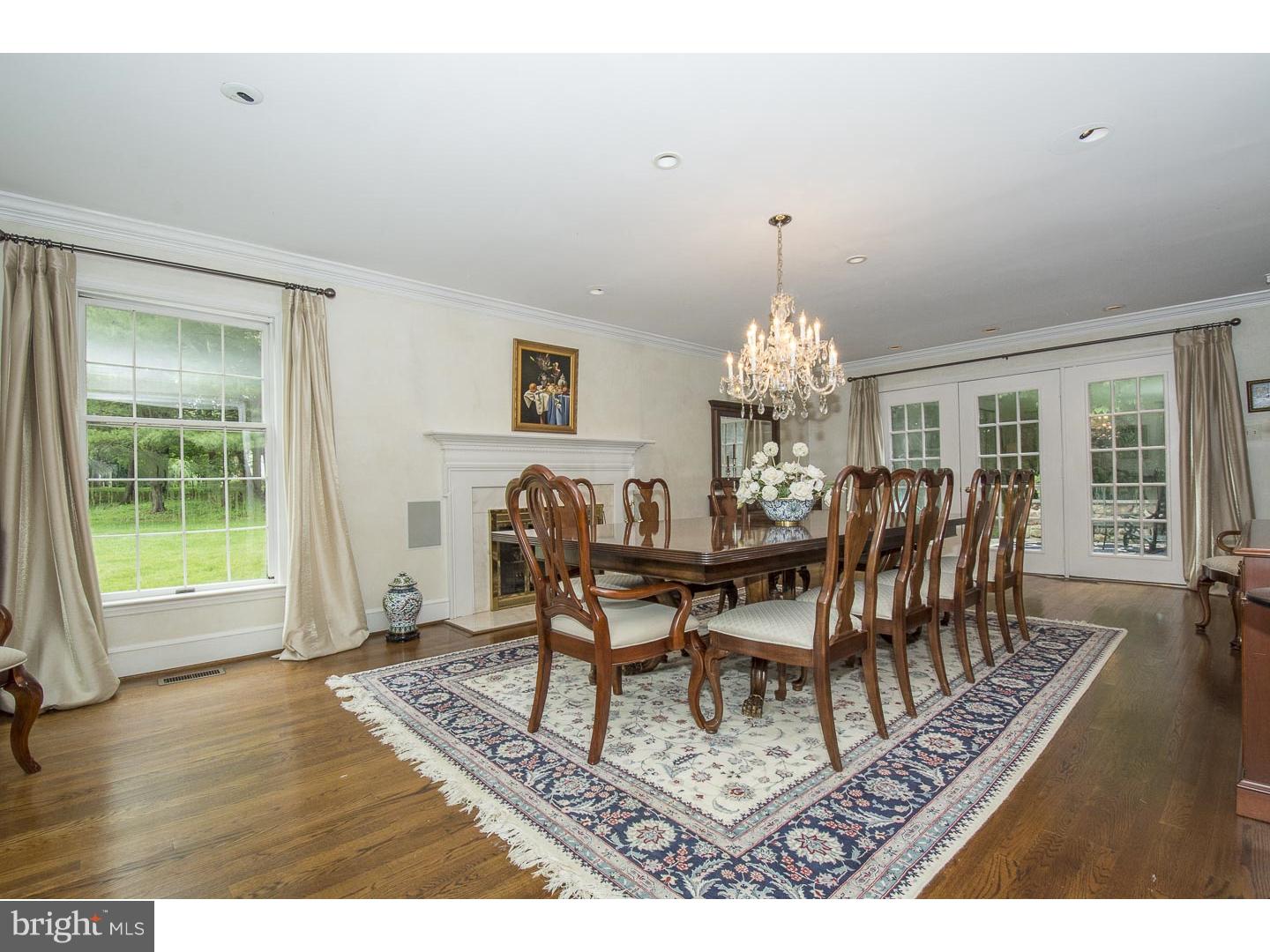 709 South Waterloo Road Devon, PA 19333 - Photo 4 of 25 a dining room with furniture a chandelier and wooden floor