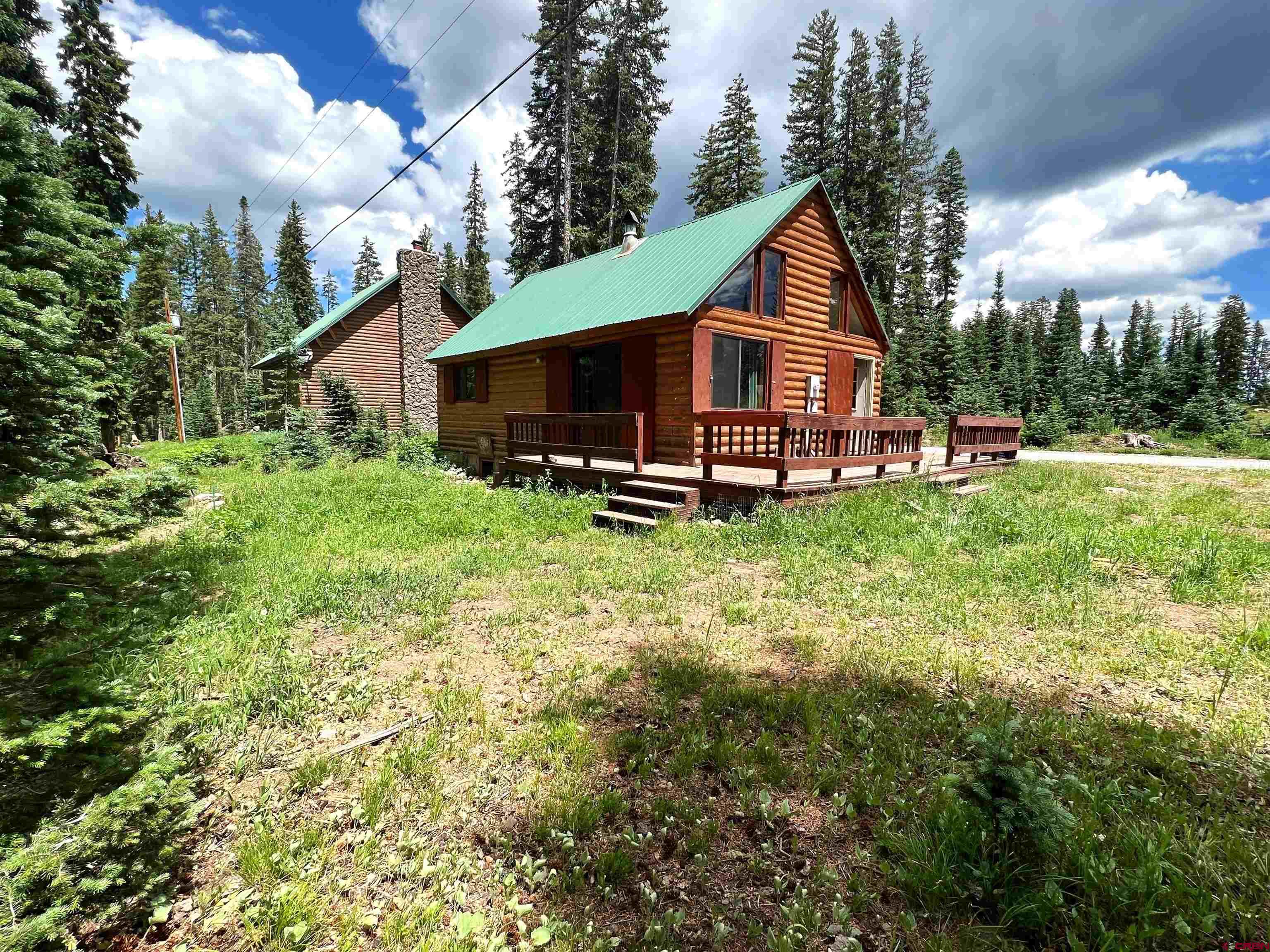 a house view with a sitting space and garden
