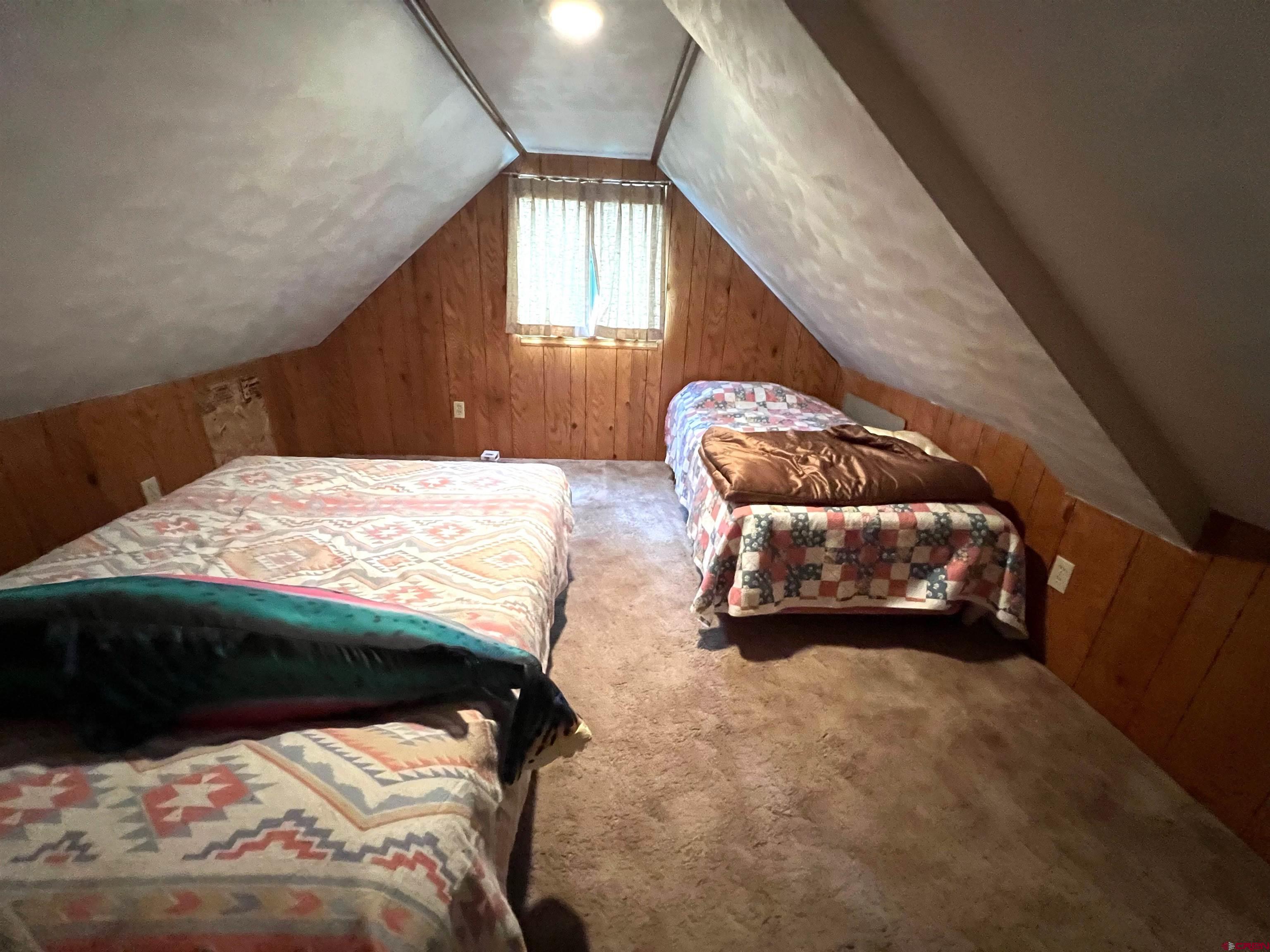 26711 High Drive Cedaredge, CO 81413 - Photo 9 of 9 a bedroom with a bed and a window