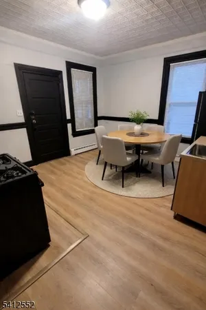 a living room with furniture and a mirror