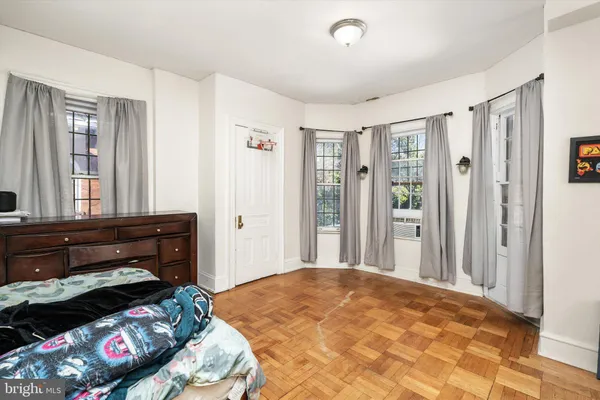 a view of room with window and hardwood floor
