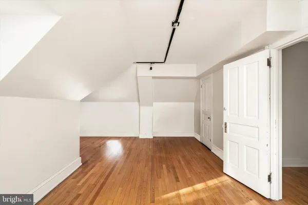 a view of an empty room with windows