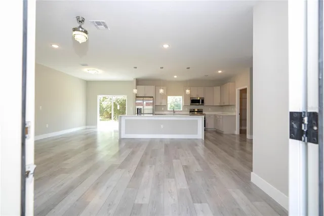 a view of kitchen with wooden floor