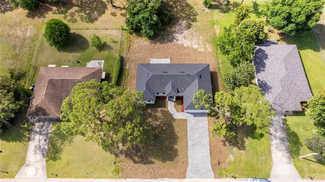 an aerial view of a swimming pool with outdoor space