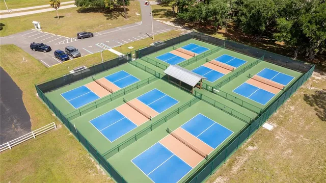 an aerial view of residential house with outdoor space and swimming pool