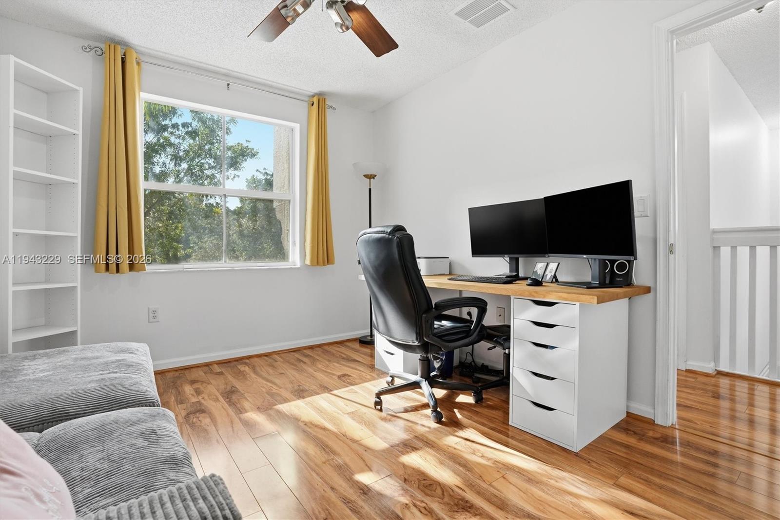 16367 Southwest 48th Street Miramar, FL 33027 - Photo 17 of 41 a livingroom with workspace and a window