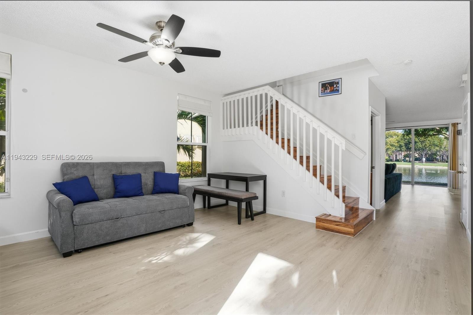 16367 Southwest 48th Street Miramar, FL 33027 - Photo 2 of 41 a living room with furniture and a wooden floor
