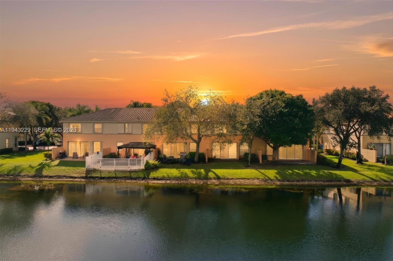 16367 Southwest 48th Street Miramar, FL 33027 - Photo 35 of 41 a view of swimming pool with outdoor seating and lake view
