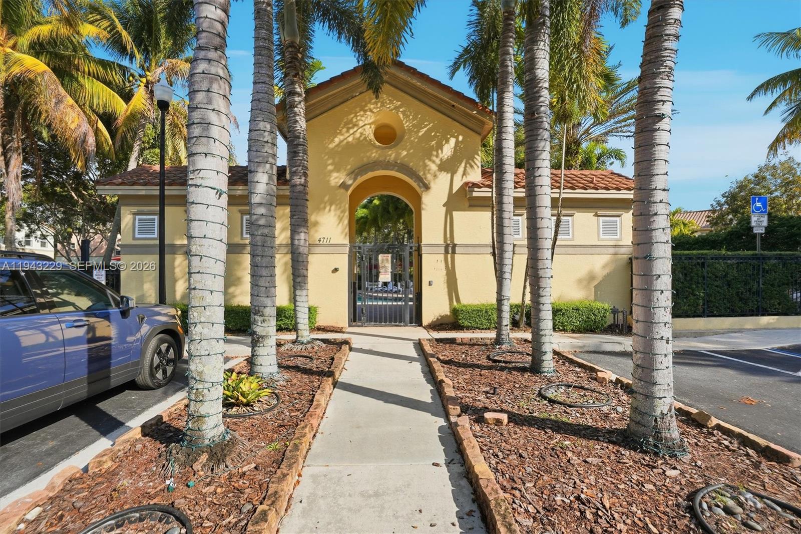 16367 Southwest 48th Street Miramar, FL 33027 - Photo 37 of 41 a front view of a house with a garden