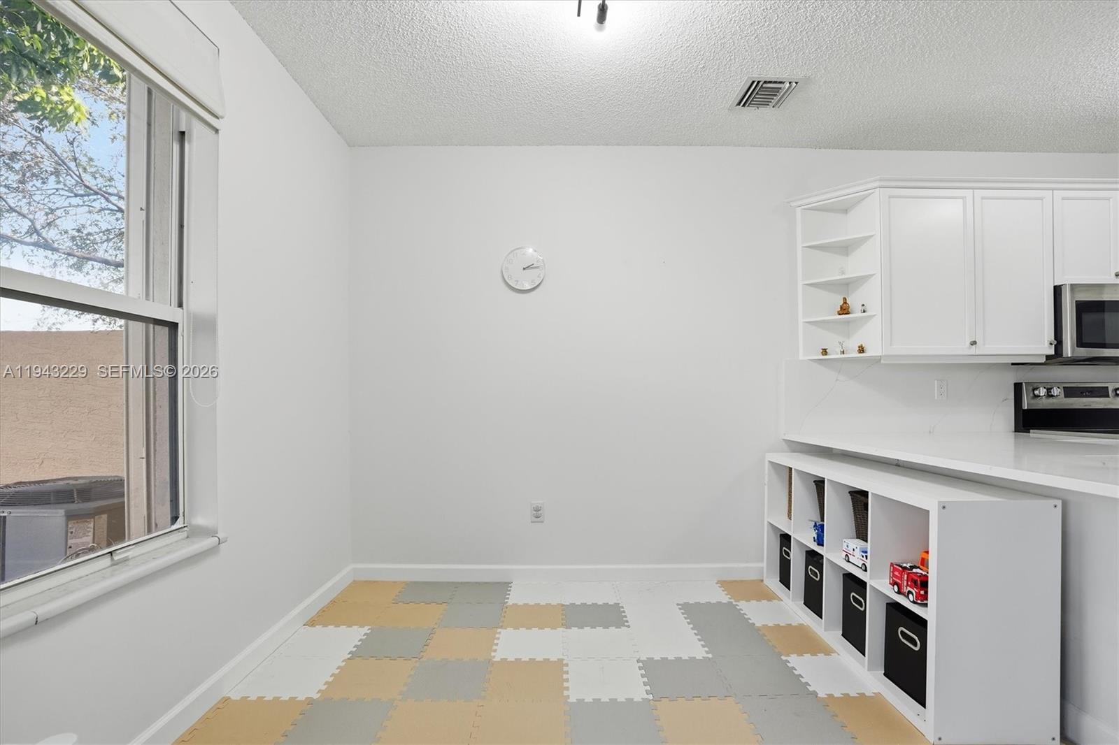 16367 Southwest 48th Street Miramar, FL 33027 - Photo 8 of 41 a view of kitchen with furniture and wooden floor