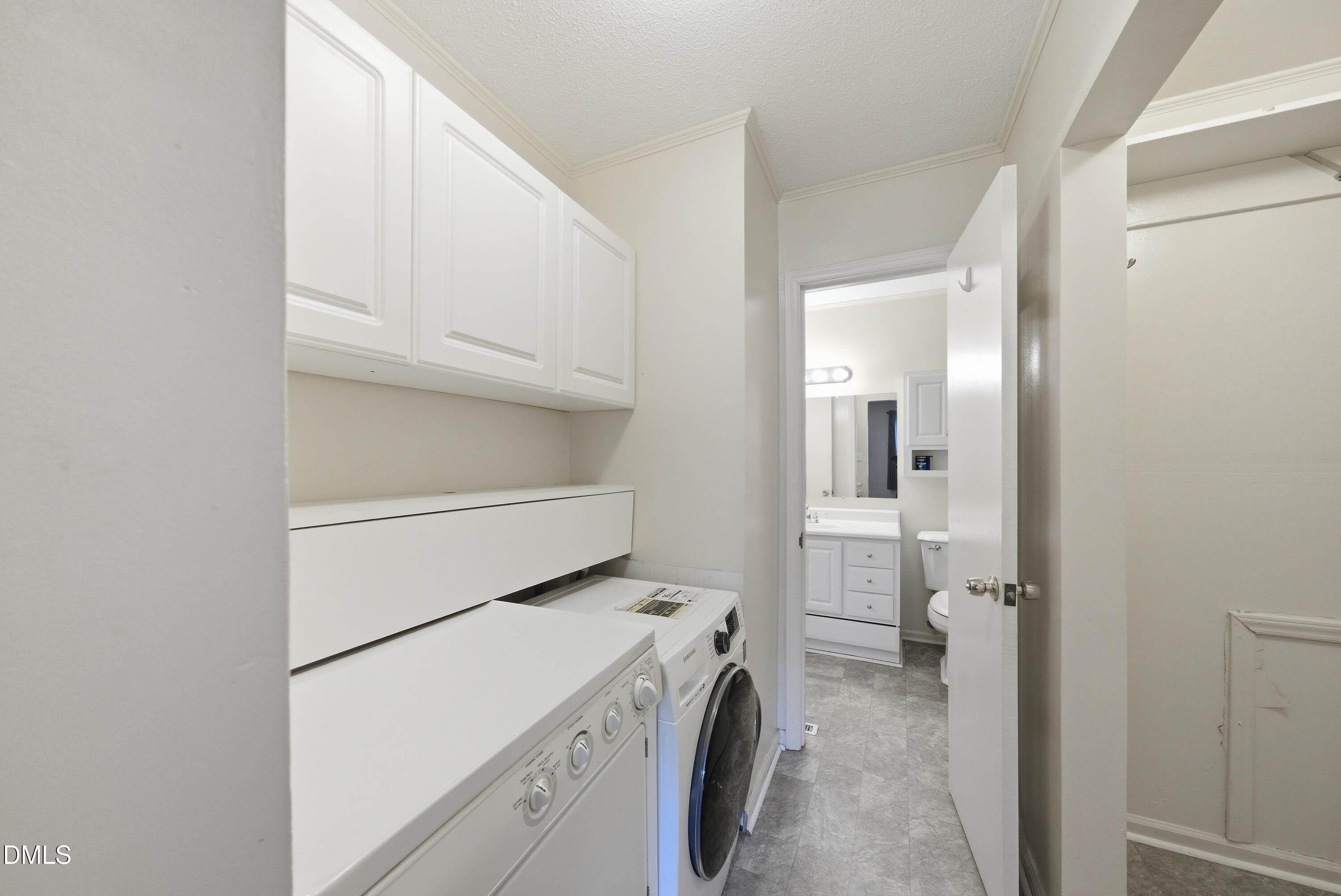 6355 New Market Way Raleigh, NC 27615 - Photo 29 of 30 a utility room with dryer and washer