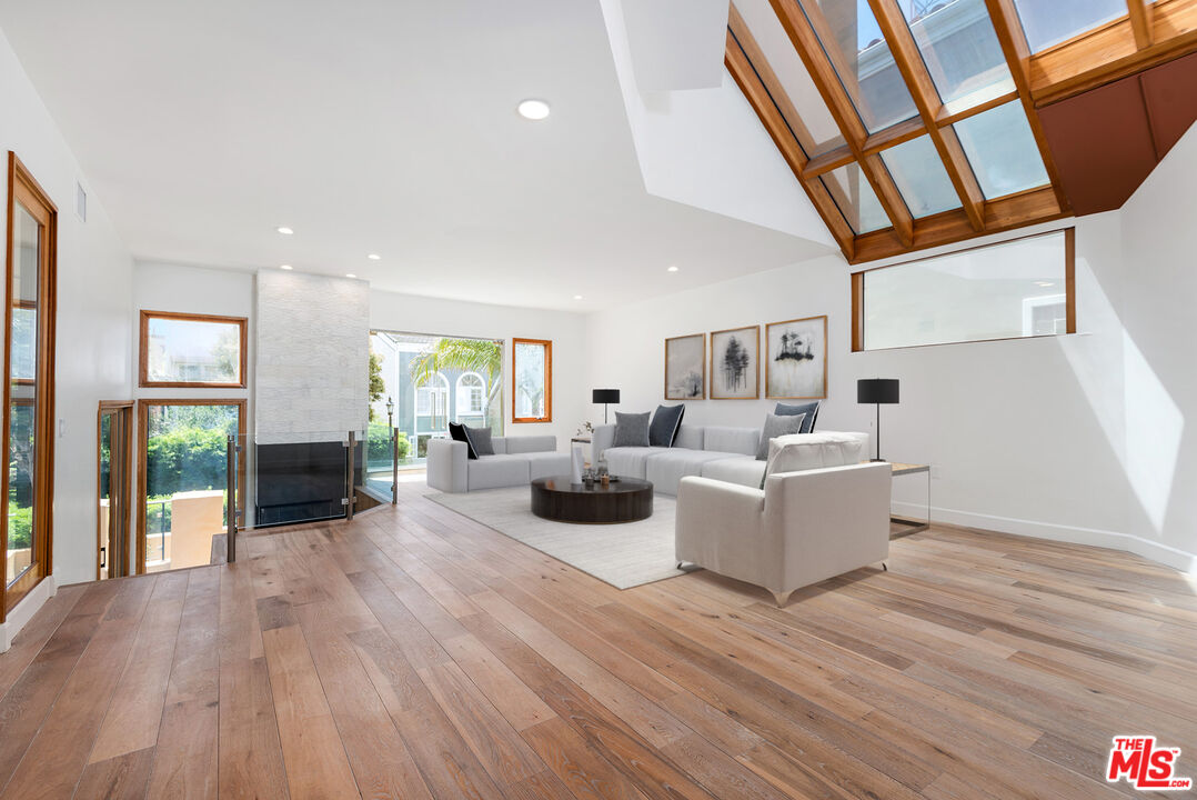 117 Ketch Mall Marina del Rey, CA 90292 - Photo 1 of 43 a living room with furniture and a wooden floor