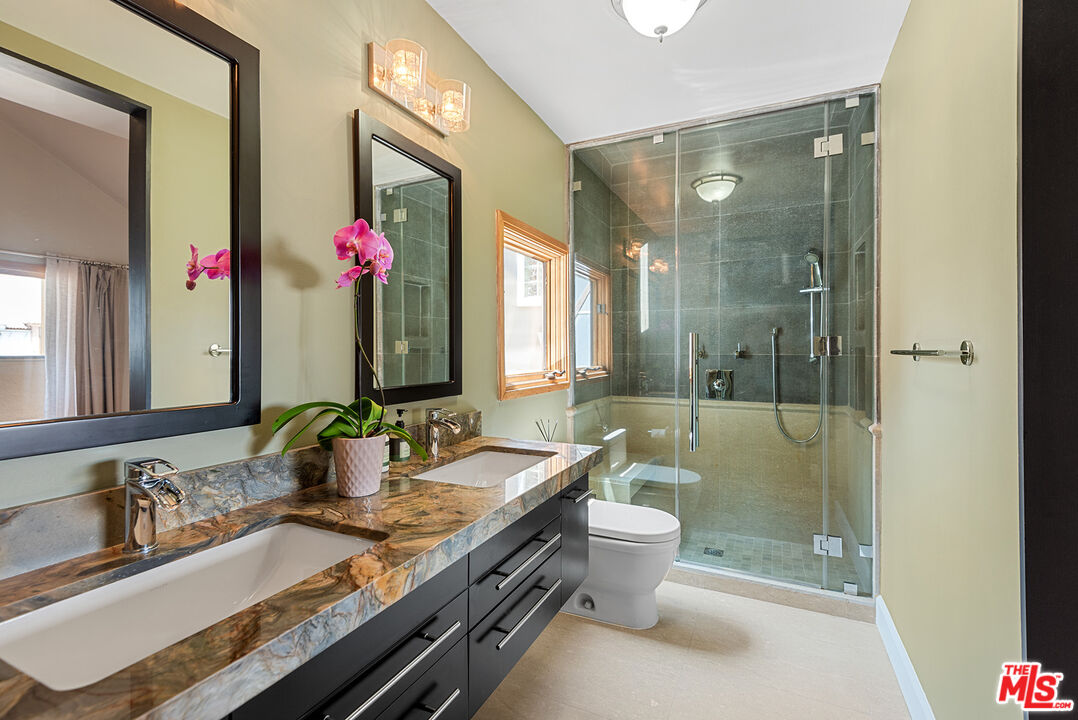 117 Ketch Mall Marina del Rey, CA 90292 - Photo 22 of 43 a bathroom with a granite countertop sink a toilet and shower