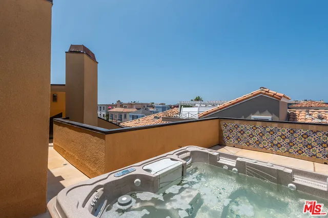 a terrace with a table and chairs
