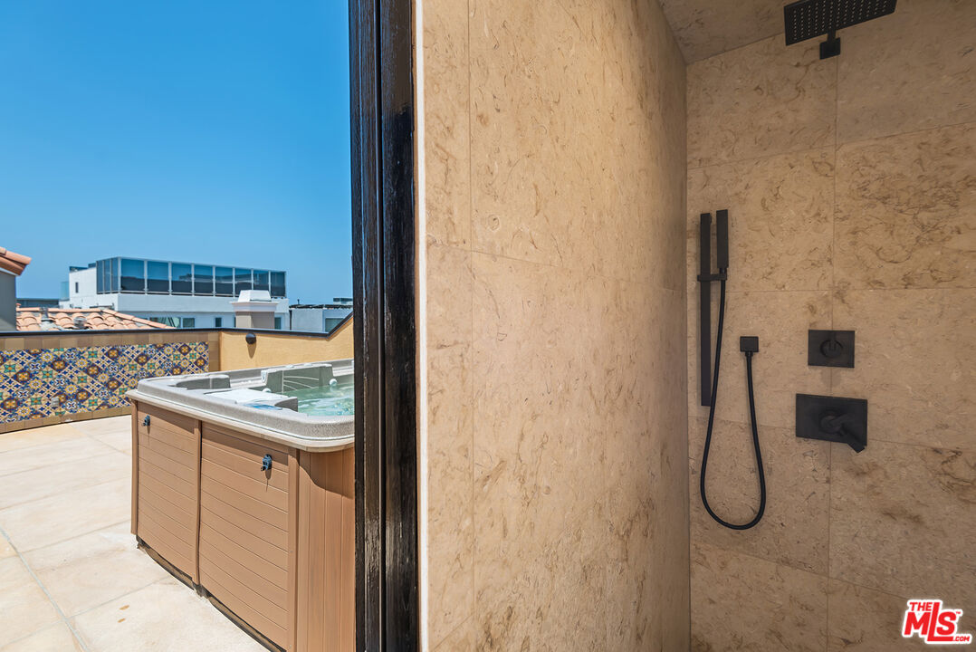 117 Ketch Mall Marina del Rey, CA 90292 - Photo 26 of 43 a bathroom with a granite countertop sink and a mirror