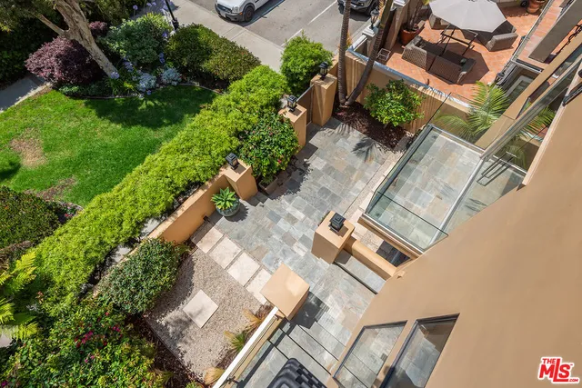 a view of a entryway with flower plants