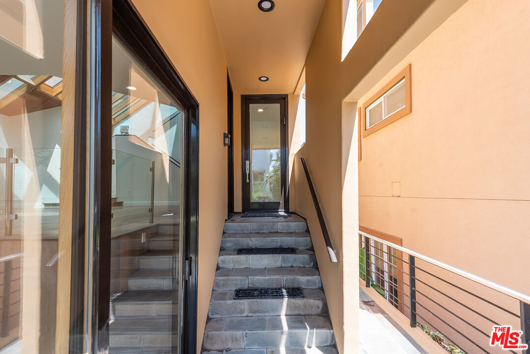 117 Ketch Mall Marina del Rey, CA 90292 - Photo 3 of 43 a view of staircase with wooden floor and windows