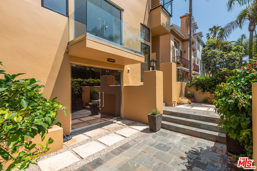 117 Ketch Mall Marina del Rey, CA 90292 - Photo 33 of 43 a view of a house with a large windows and flower plants