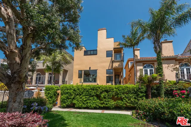 an aerial view of a city with ocean view