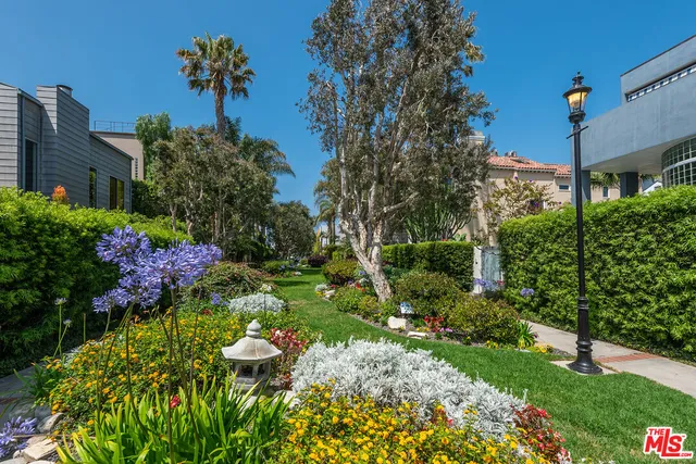 an aerial view of a city with ocean view
