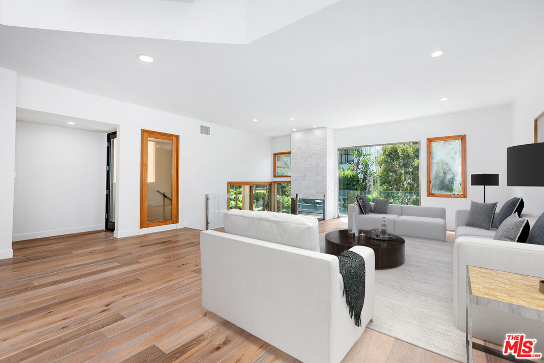 117 Ketch Mall Marina del Rey, CA 90292 - Photo 4 of 43 a living room with furniture and a large window