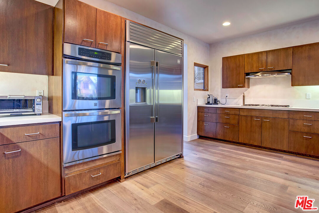 117 Ketch Mall Marina del Rey, CA 90292 - Photo 6 of 43 a kitchen with stainless steel appliances granite countertop a refrigerator and a sink