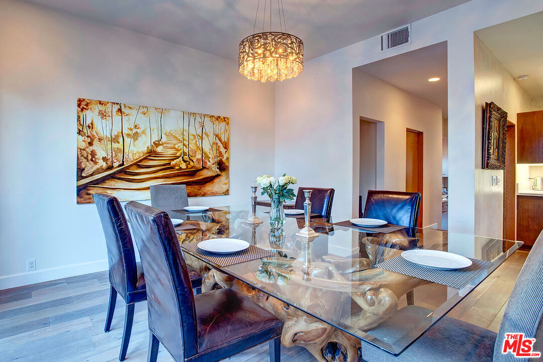 117 Ketch Mall Marina del Rey, CA 90292 - Photo 10 of 43 a dining room with furniture and wooden floor