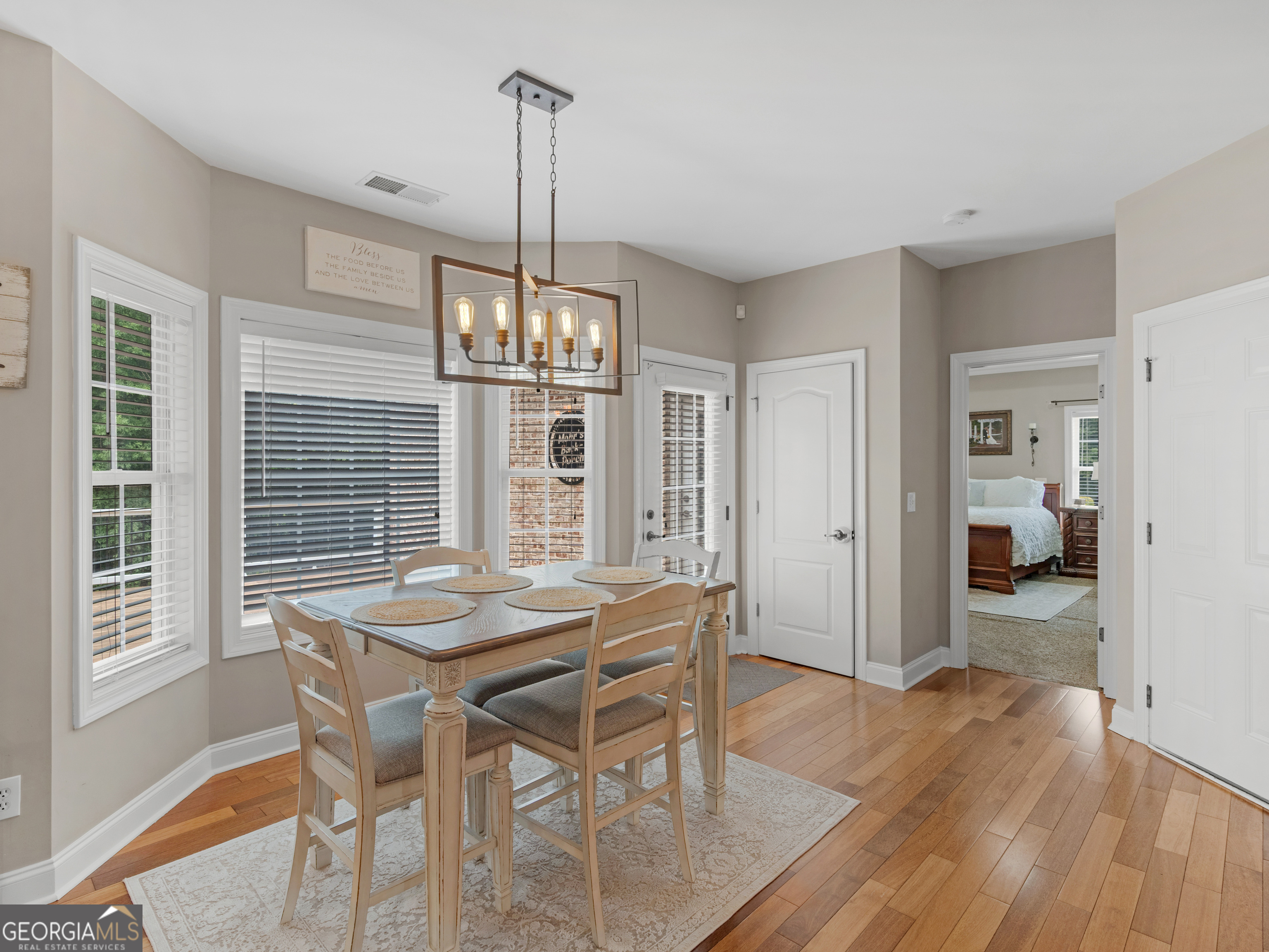 221 Hummingbird Court Hampton, GA 30228 - Photo 27 of 77 a view of a dining room with furniture window and wooden floor