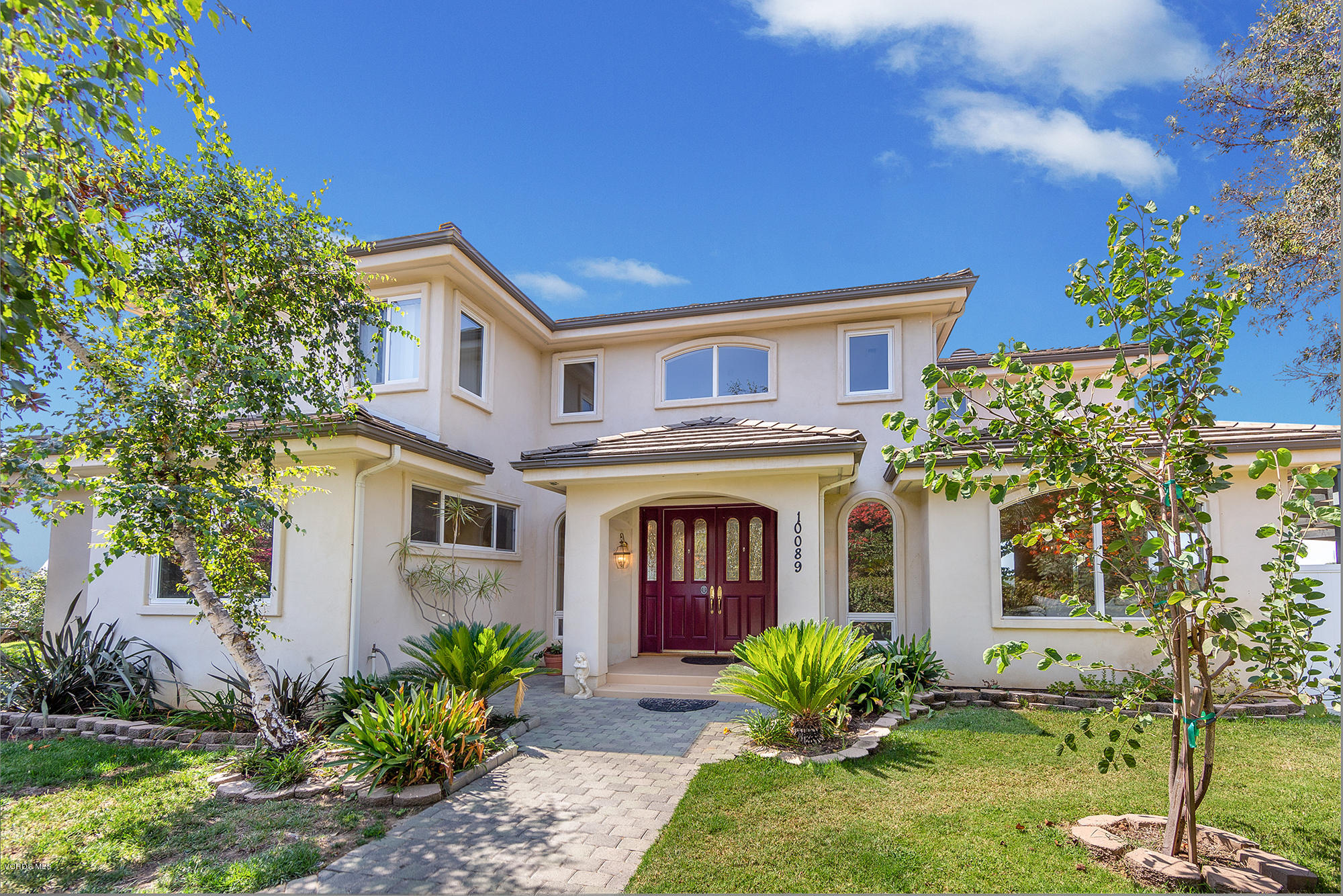 10089 Stockton Road Moorpark, CA 93021 - Photo 1 of 39 a front view of a house with garden
