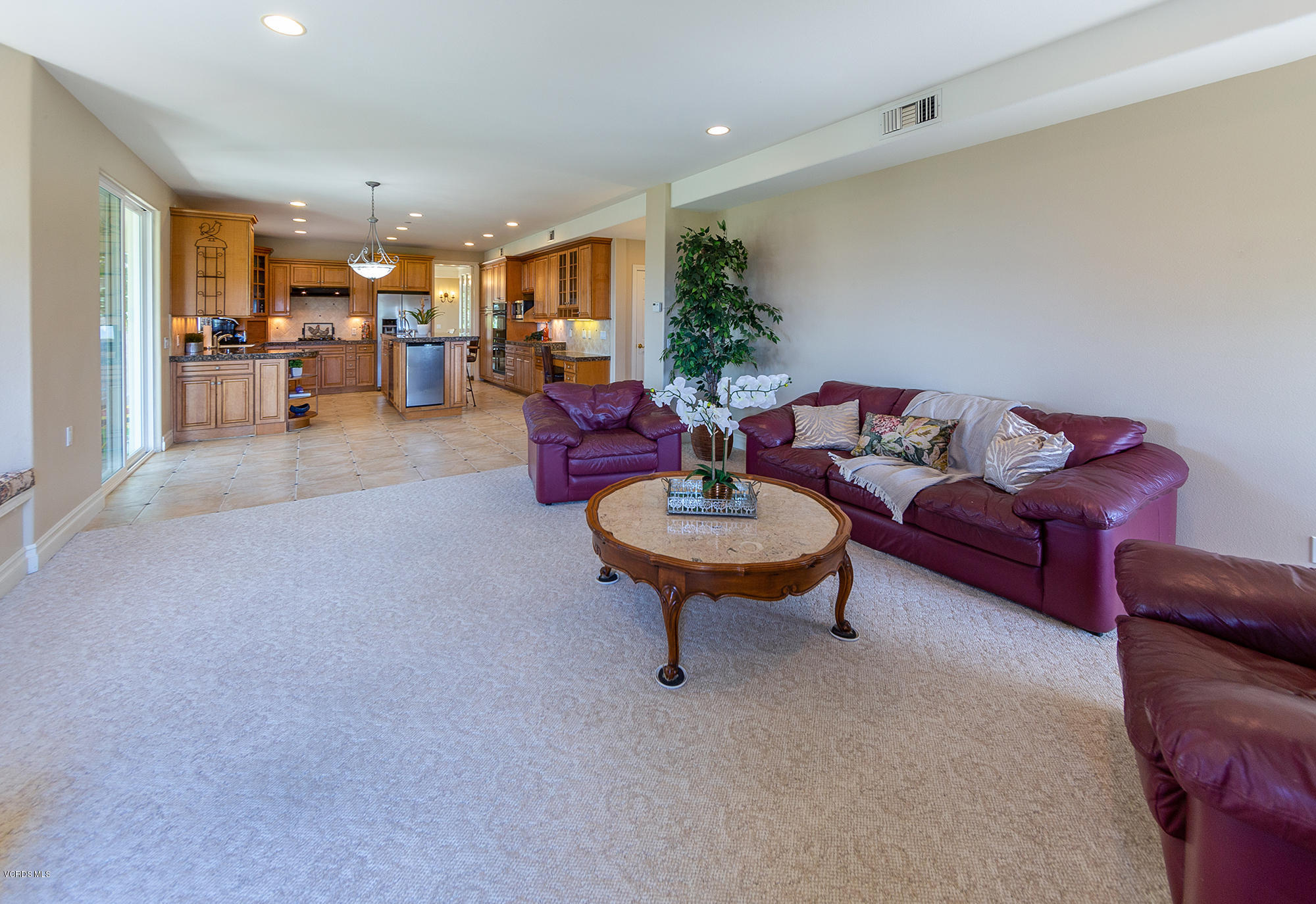 10089 Stockton Road Moorpark, CA 93021 - Photo 12 of 39 a living room with furniture kitchen view and a table
