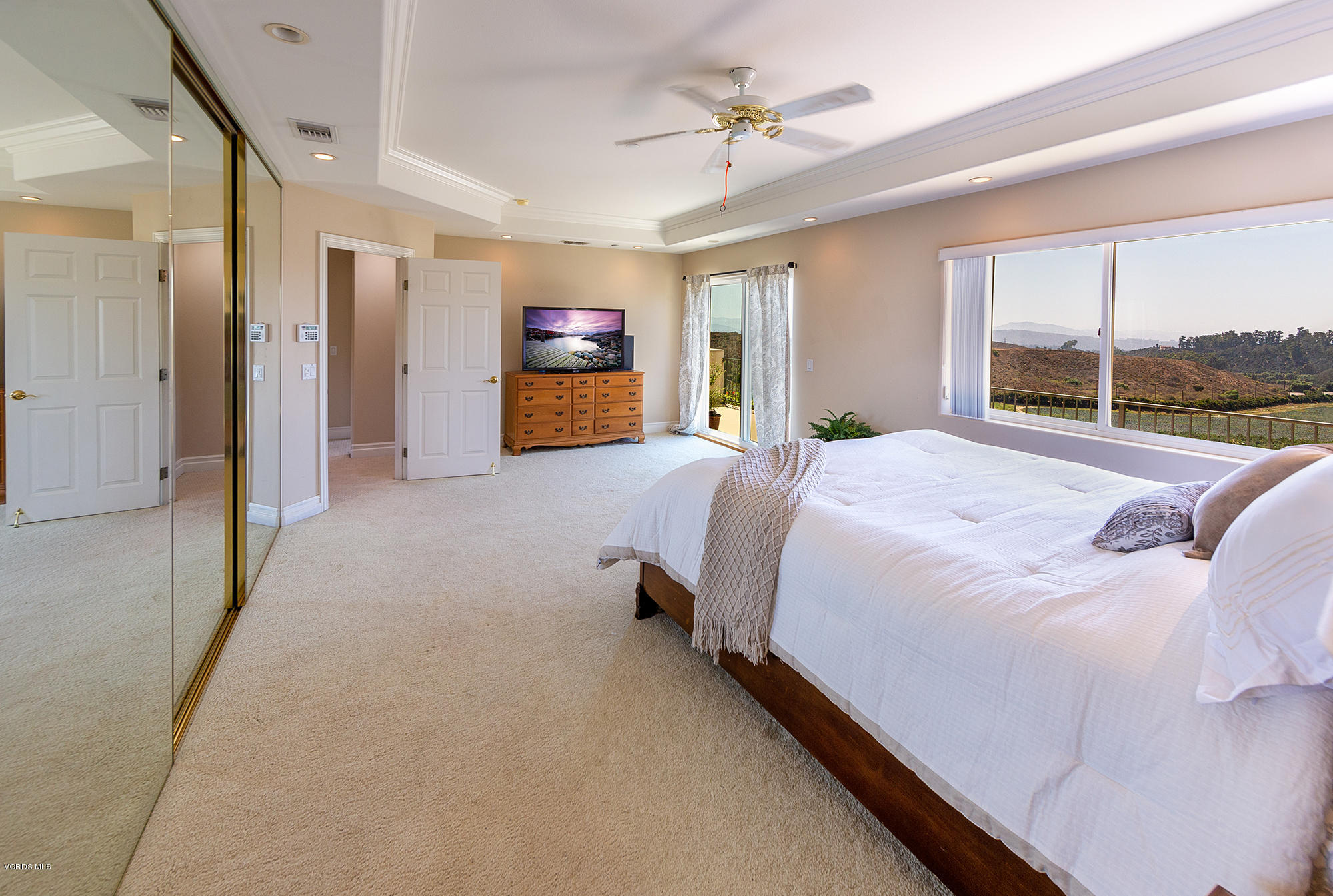 10089 Stockton Road Moorpark, CA 93021 - Photo 15 of 39 a spacious bedroom with a bed and a large window
