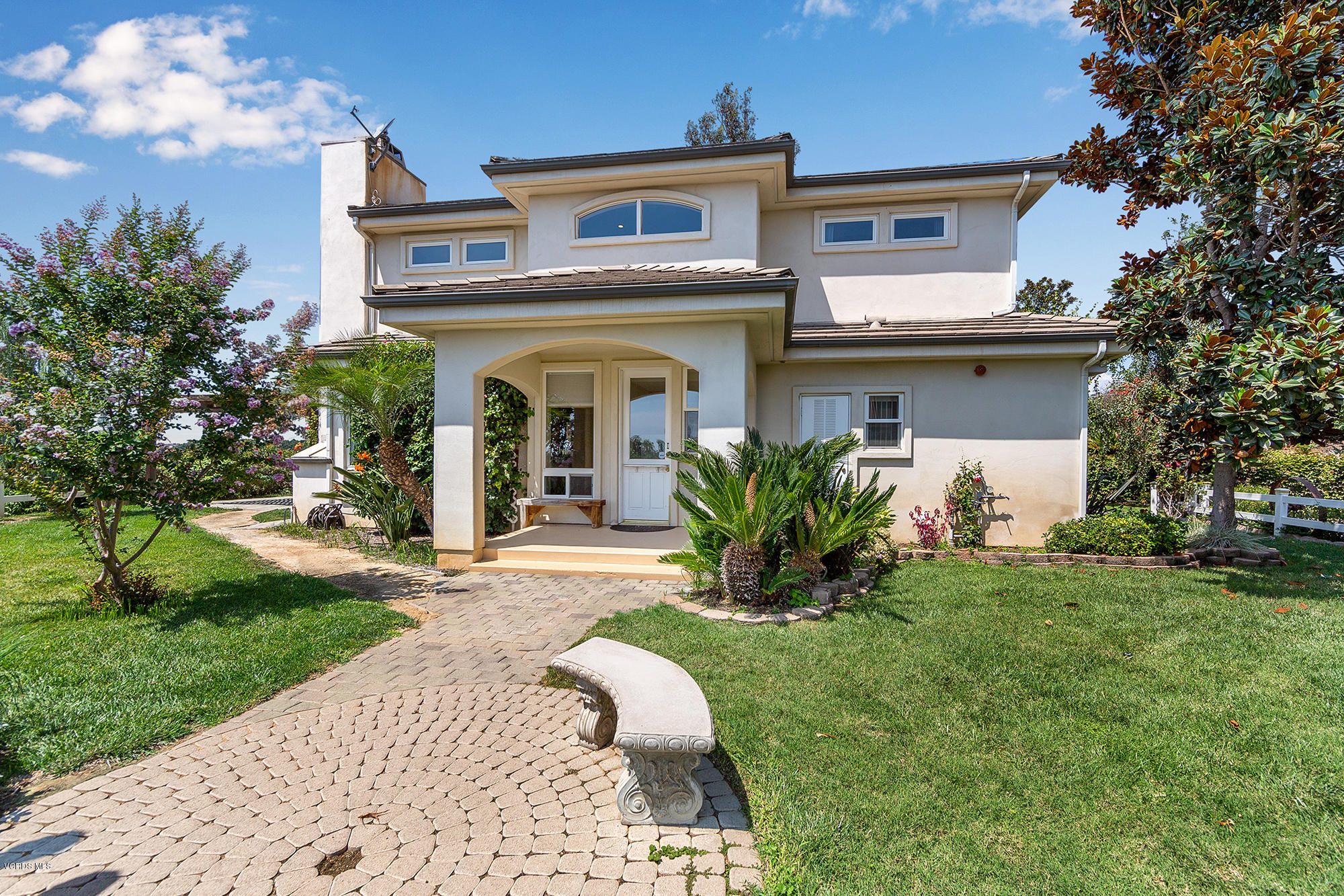 10089 Stockton Road Moorpark, CA 93021 - Photo 3 of 39 a front view of a house with a garden