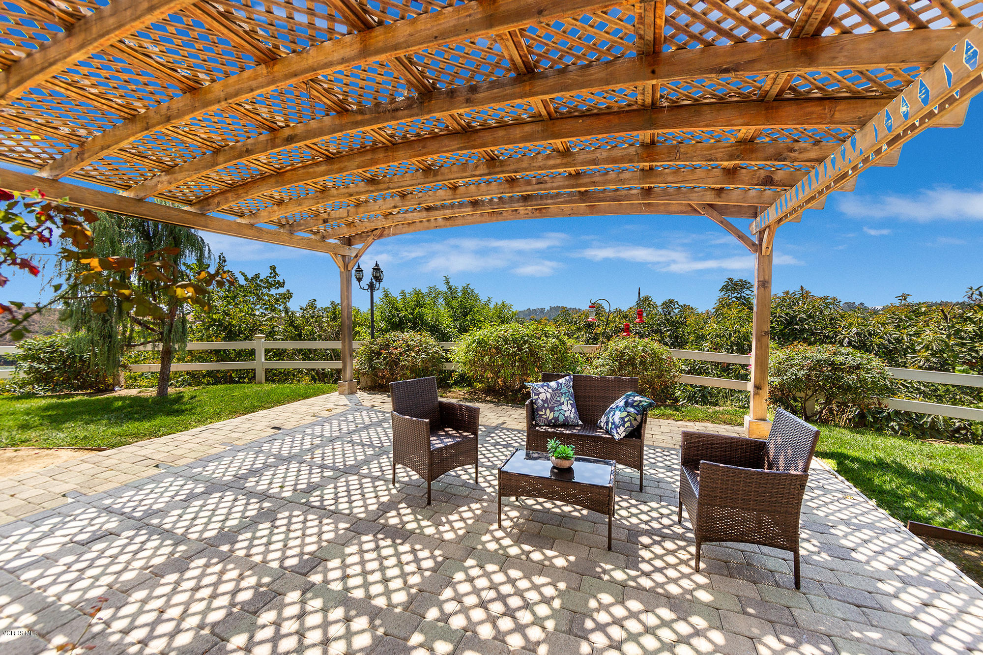 10089 Stockton Road Moorpark, CA 93021 - Photo 23 of 39 a patio with glass top table and chairs