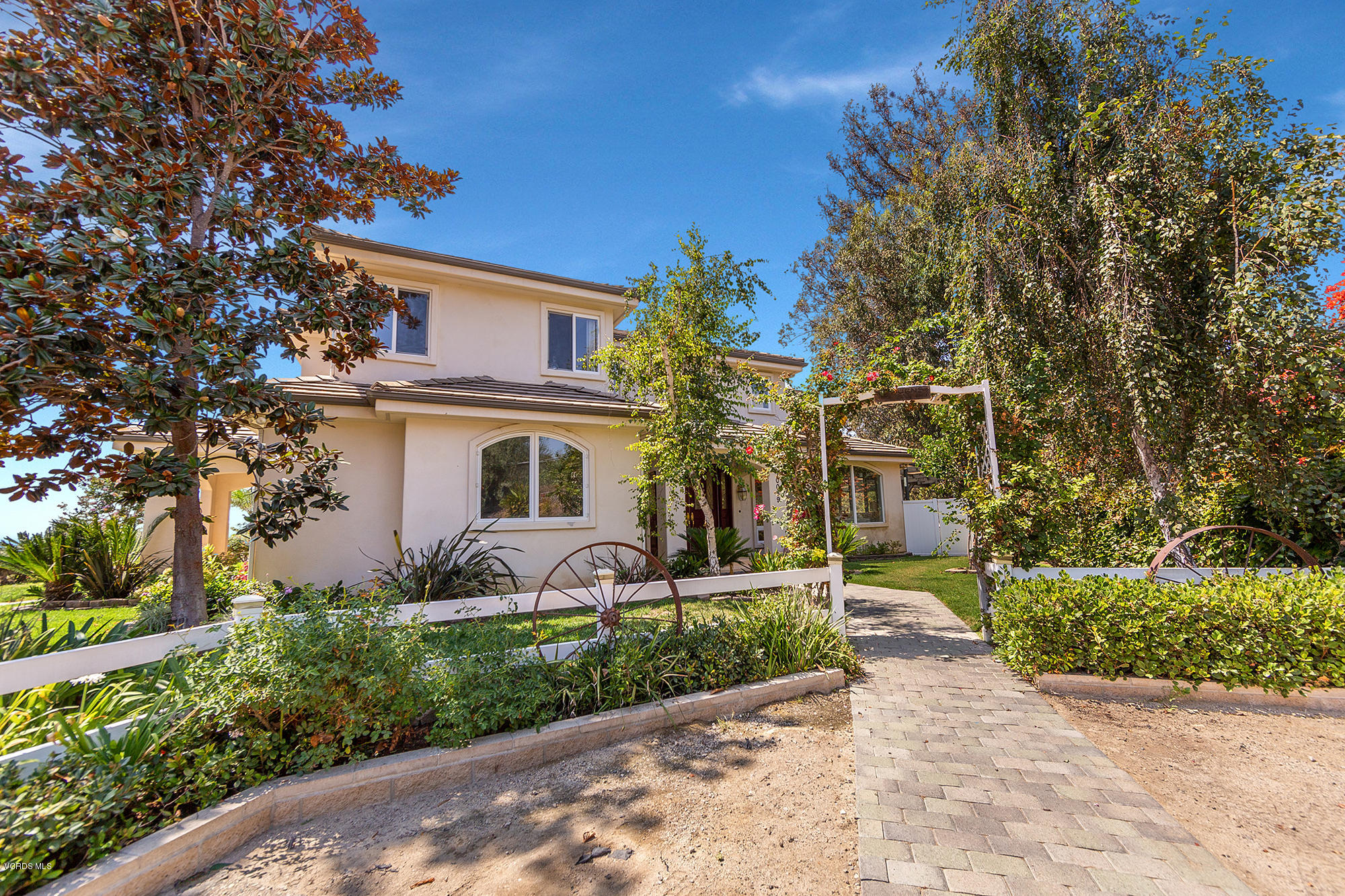 10089 Stockton Road Moorpark, CA 93021 - Photo 25 of 39 a front view of a house with garden