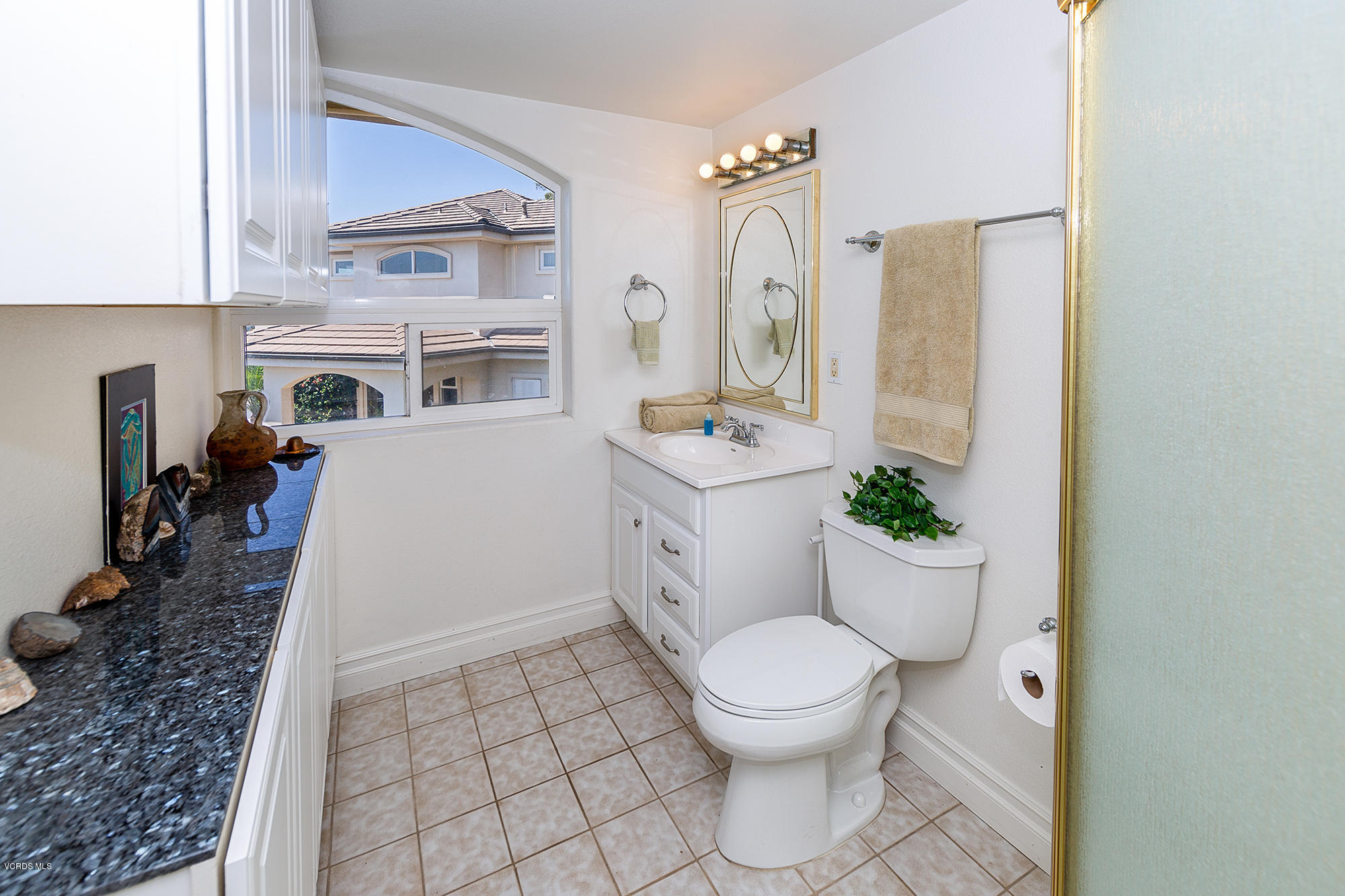 10089 Stockton Road Moorpark, CA 93021 - Photo 32 of 39 a white toilet sitting next to a bathroom sink
