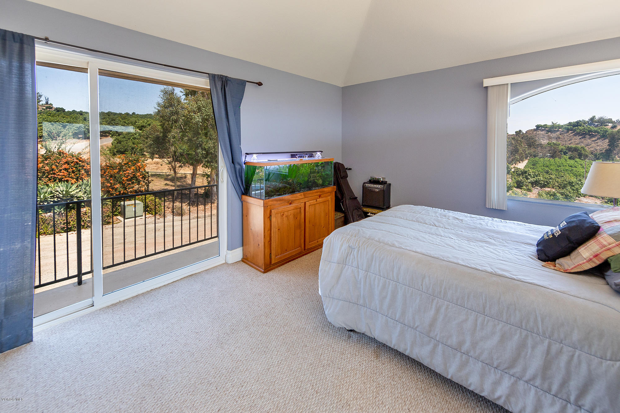 10089 Stockton Road Moorpark, CA 93021 - Photo 33 of 39 a bed sitting in a bedroom next to a large window