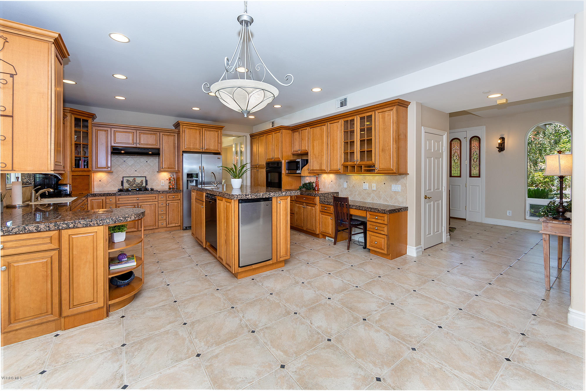 10089 Stockton Road Moorpark, CA 93021 - Photo 10 of 39 a view of a kitchen with stainless steel appliances granite countertop a stove and cabinets
