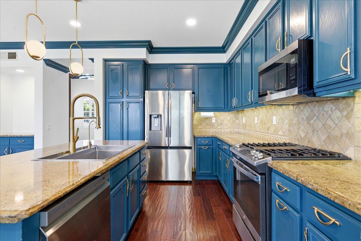 23732 Bella Vista Road Corona, CA 92883 - Photo 10 of 49 a kitchen with granite countertop stainless steel appliances cabinets a sink and a counter top space