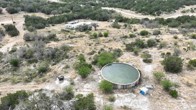 a bedroom with bed and a chandelier